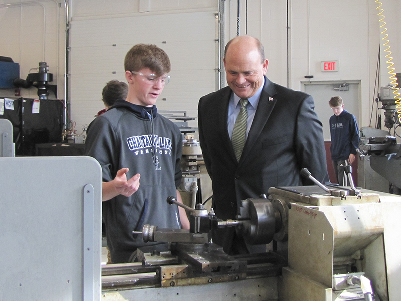 Congressman Ted Reed with student in Manufacturing Lab